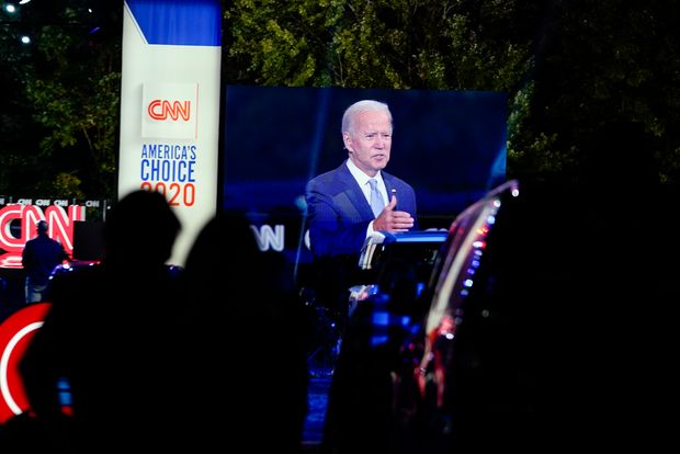 Joe Biden is seen on a video screen as he participates in a CNN town...