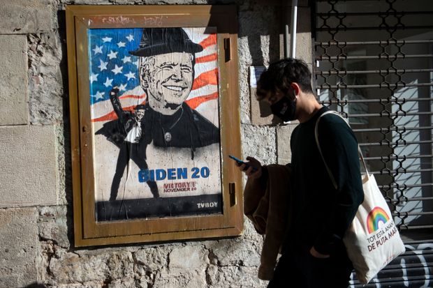 Work by Italian street artist TvBoy depicting U.S. President-elect Joe Biden on a wall in...