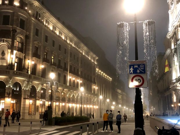 The Four Seasons Hotel (pictured left) near Madrid's Puerta del Sol on Nov. 17, 2020.